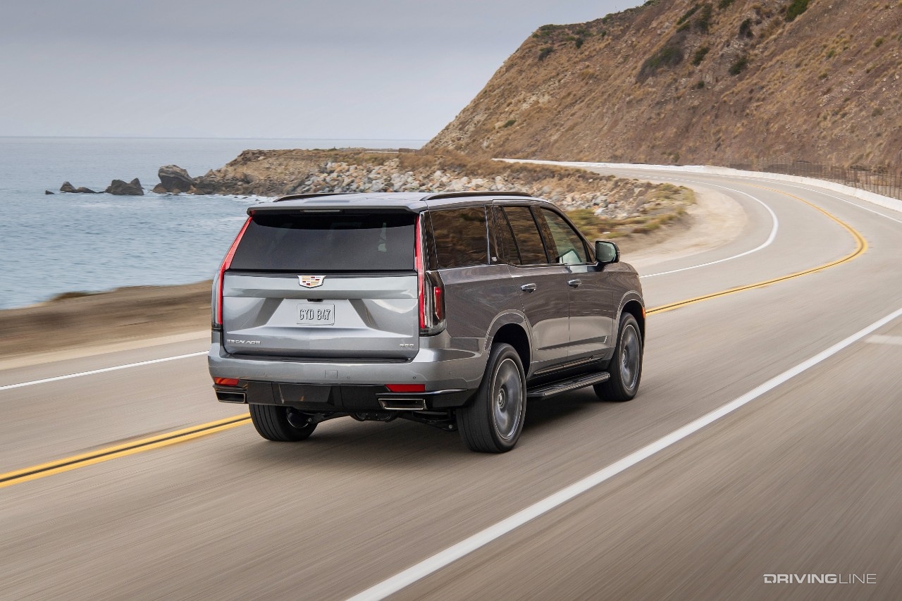 Cadillac Escalade on highway from rear