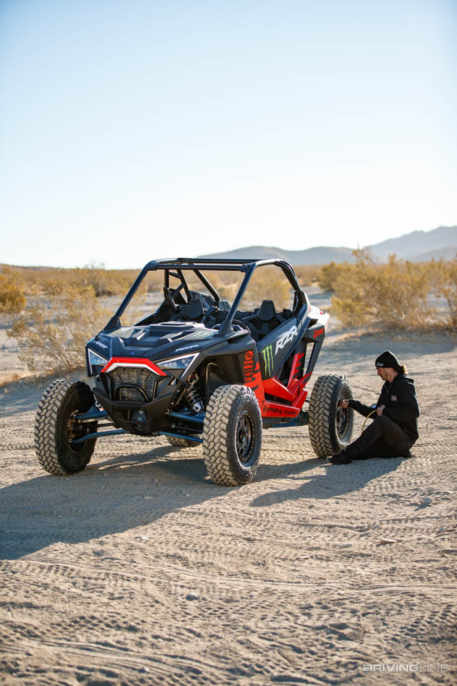 Crew airing down Nitto Trail Grappler SxS tires on Polaris RZR
