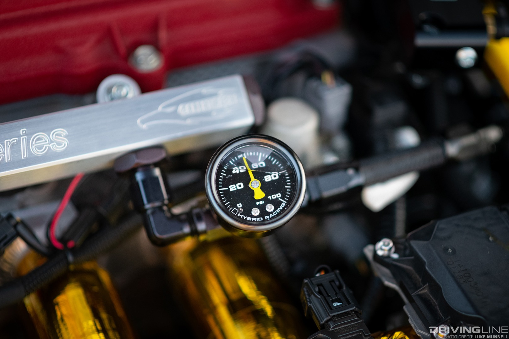 Mario Mojica Nitto Tire NT01 turbocharged Honda Fit closeup of Hybrid Racing fuel pressure gauge