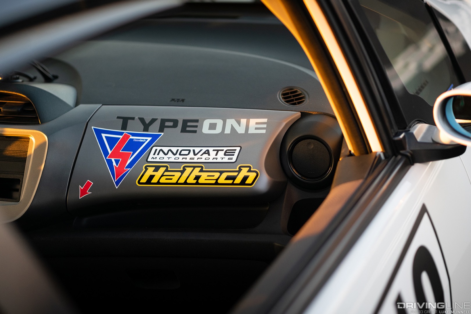 Mario Mojica Nitto Tire NT01 turbocharged Honda Fit closeup of Haltech sticker