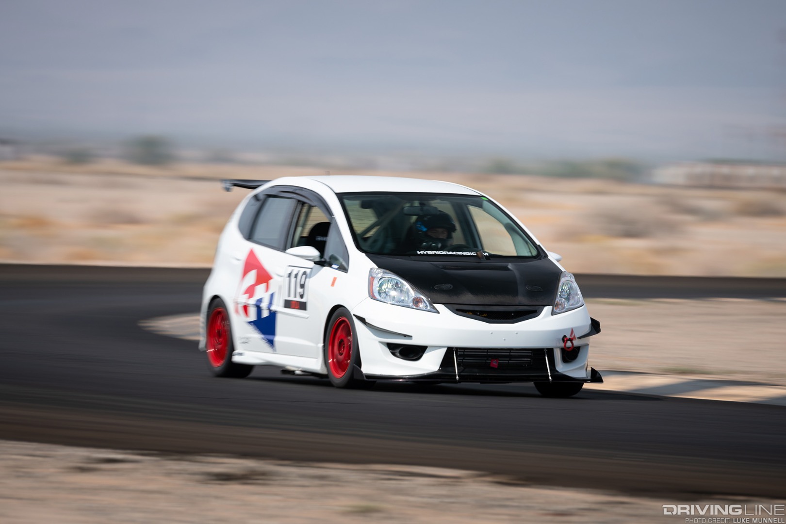 Mario Mojica Nitto Tire NT01 turbocharged Honda Fit front 3/4 corner pan blur at Chuckwalla Valley Raceway