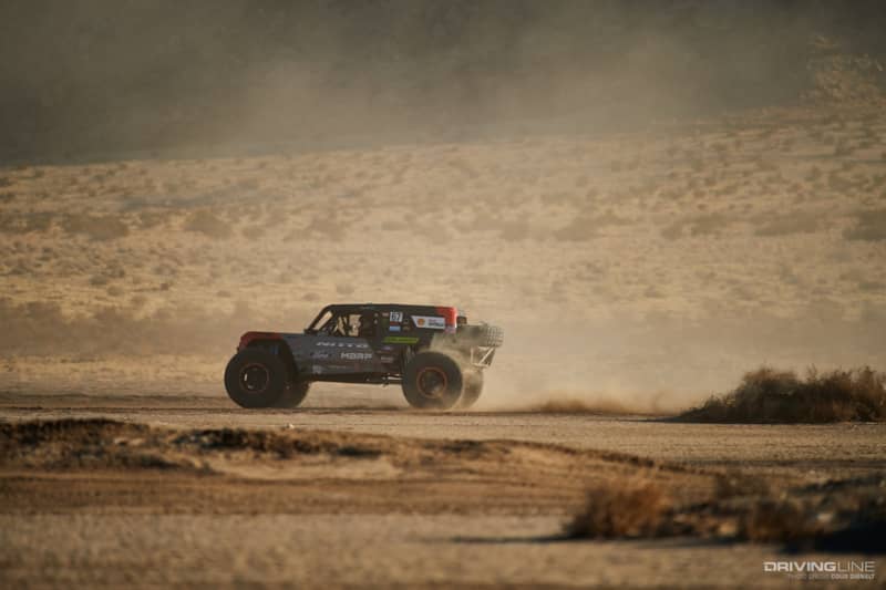 Loren Healy driving fast through the desert