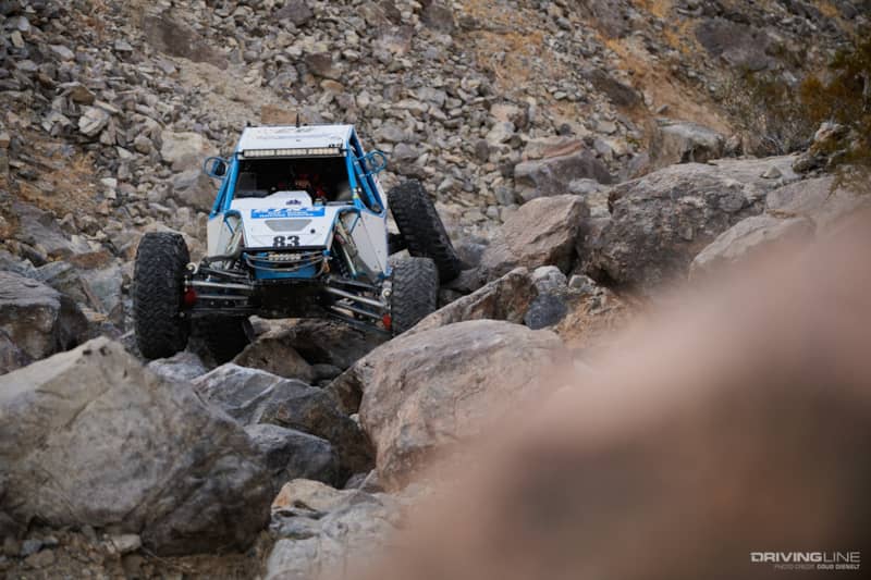 Raul Gomez driving through the rocks