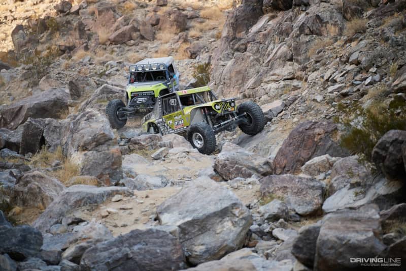 Erik Miller and Vaughn Gittin Jr. driving through the rocks