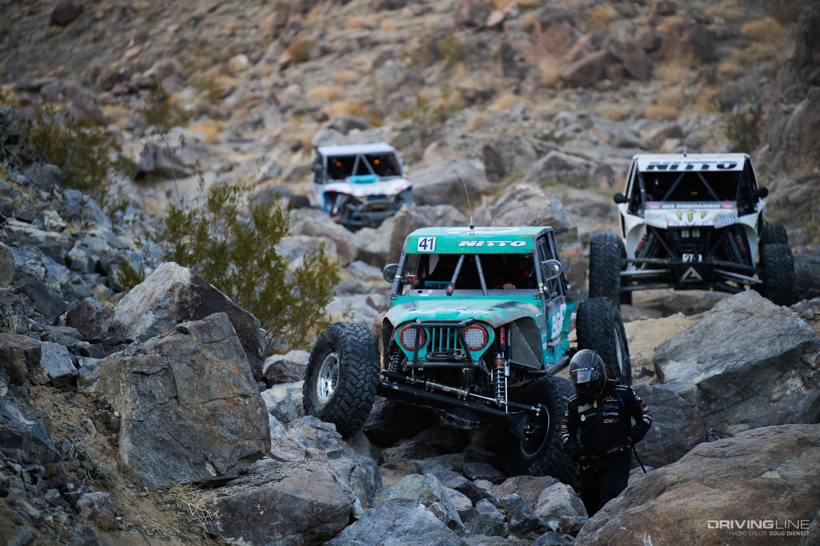 Josh Blyler getting out to winch through the rocks with Bailey Campbell and Jason Blanton behind him
