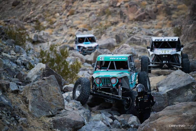 Josh Blyler getting out to winch through the rocks with Bailey Campbell and Jason Blanton behind him