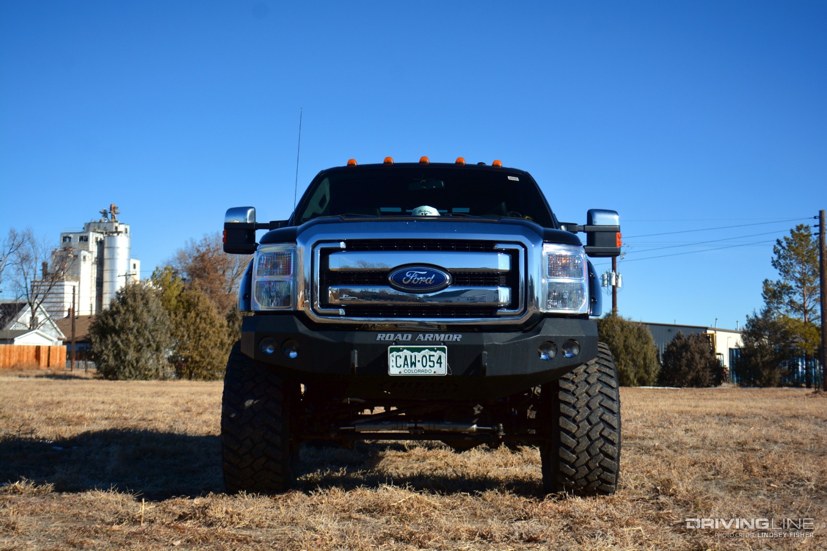 Lifted 2011 Ford F350 from front in field