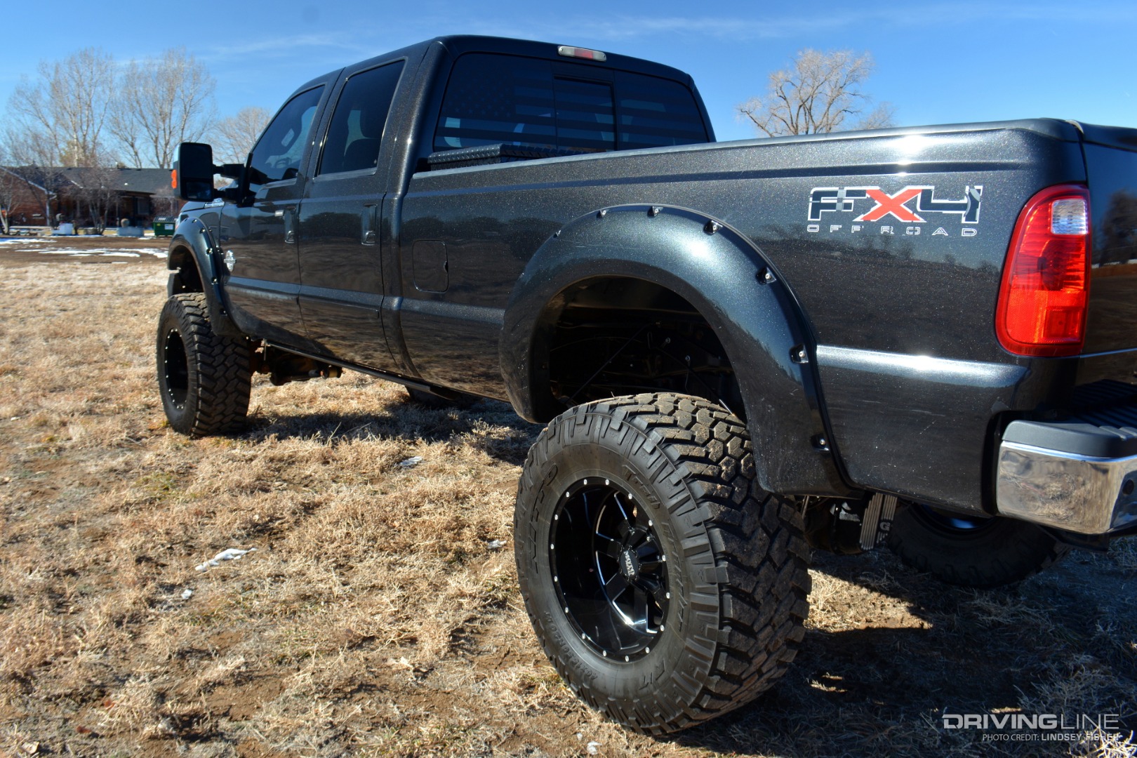 Lifted Ford F350 driver's side profile from rear
