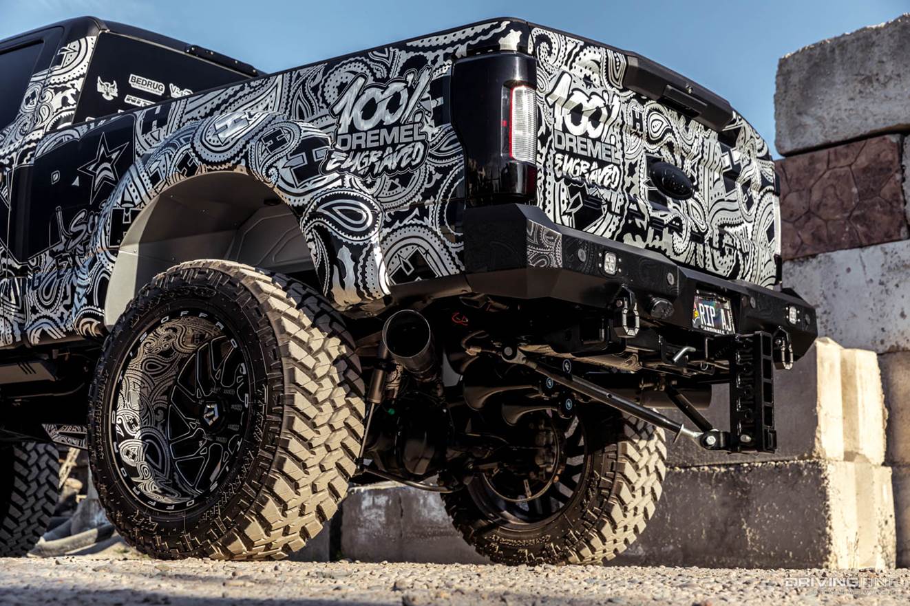 Rear end of hand engraved Ford F-250 with Nitto Trail Grappler Tires