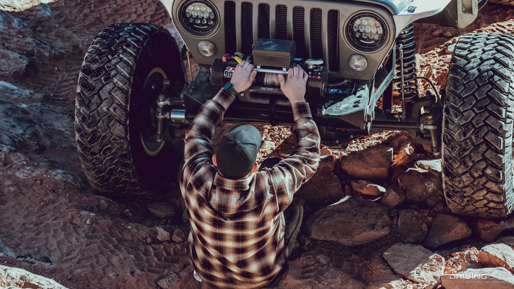 Austin Stobaugh helping a jeep