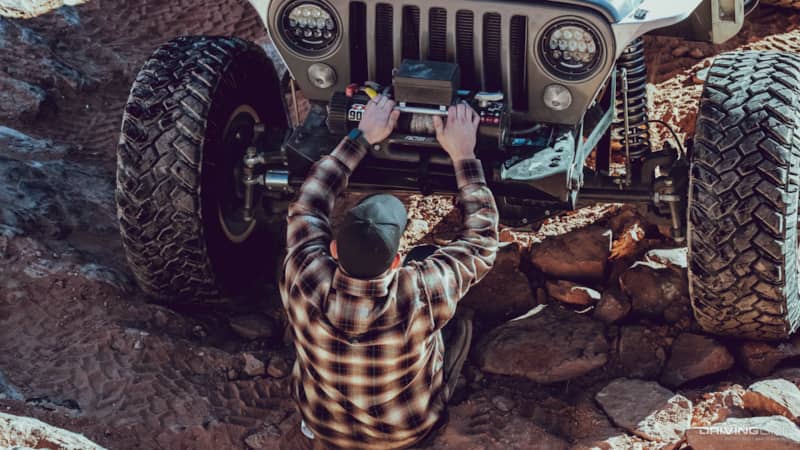 Austin Stobaugh helping a jeep
