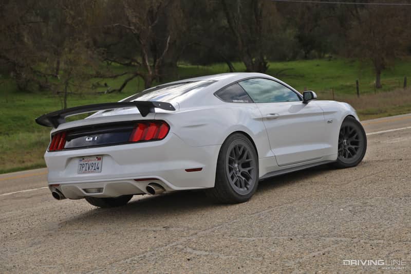 Rear driver side of white S550 Mustang GT on Nitto NT555 G2 tires