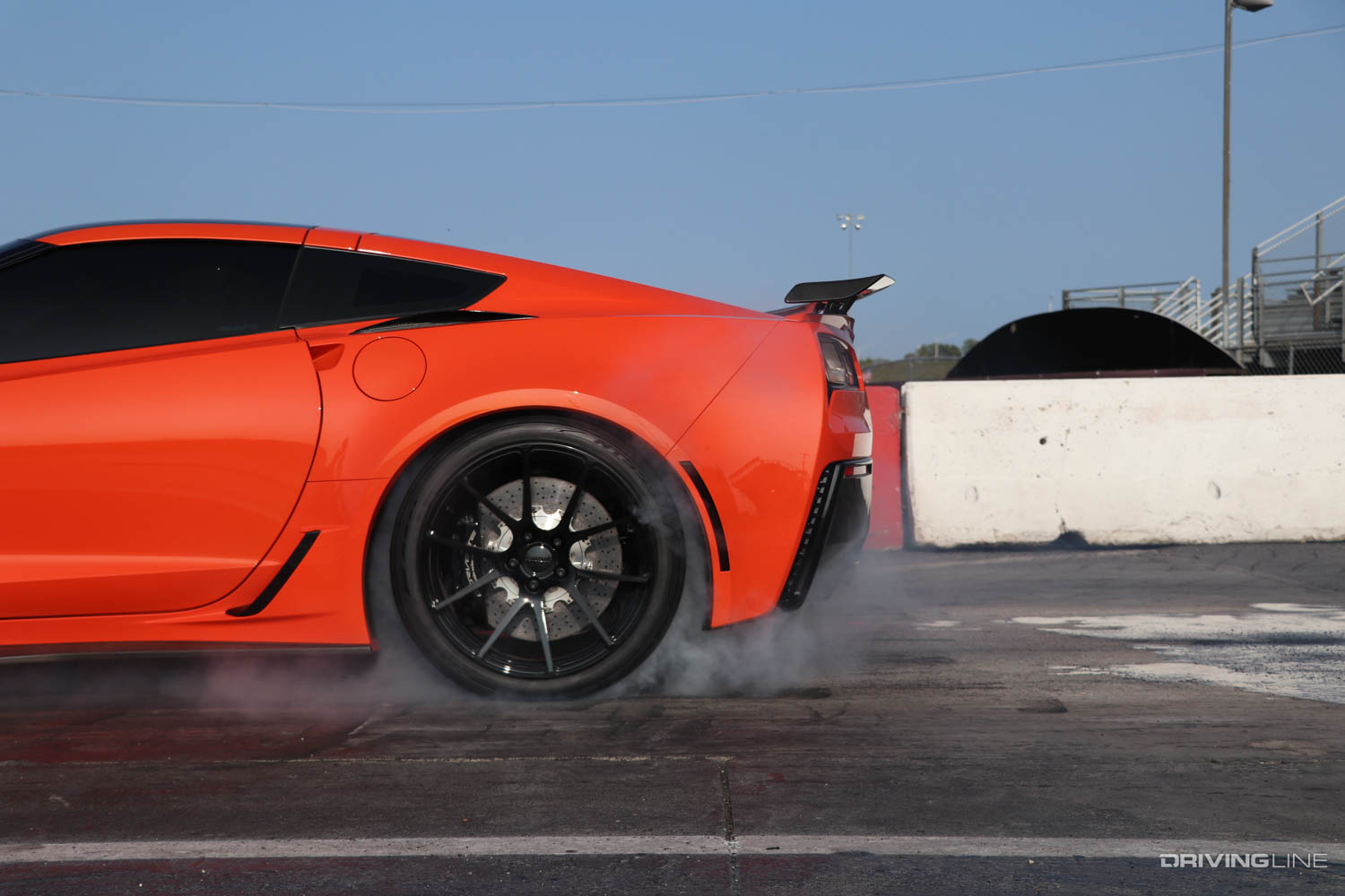 Corvette C7 doing small burnout on track with Drag Radial tires