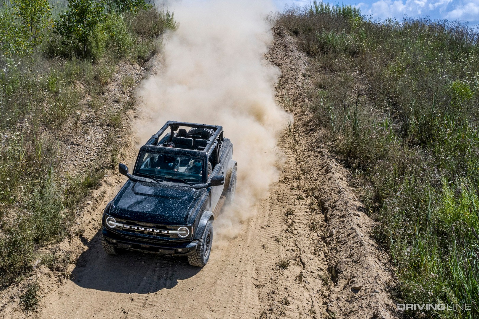 Ford Bronco on dusty trail
