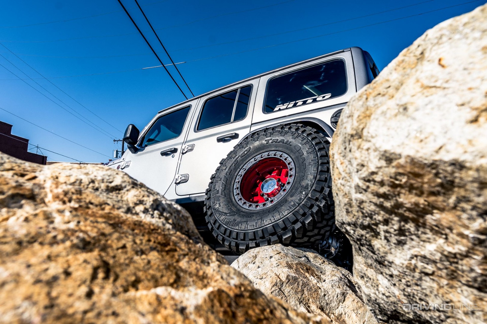 Jeep Wrangler climbing rocks on Nittos