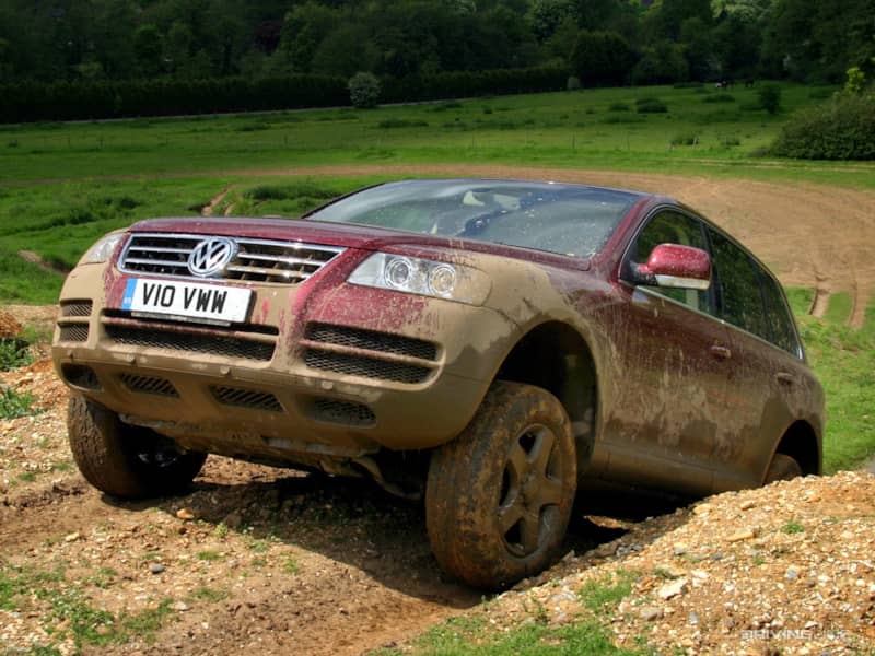 VW Touareg climbing out of mud pit