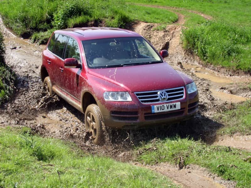 VW Touareg in fuschia in the mud