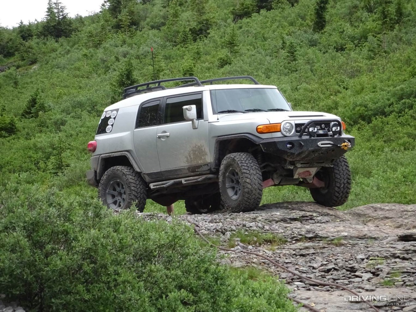 Toyota FJ Cruisre on Nittos on the trail front view