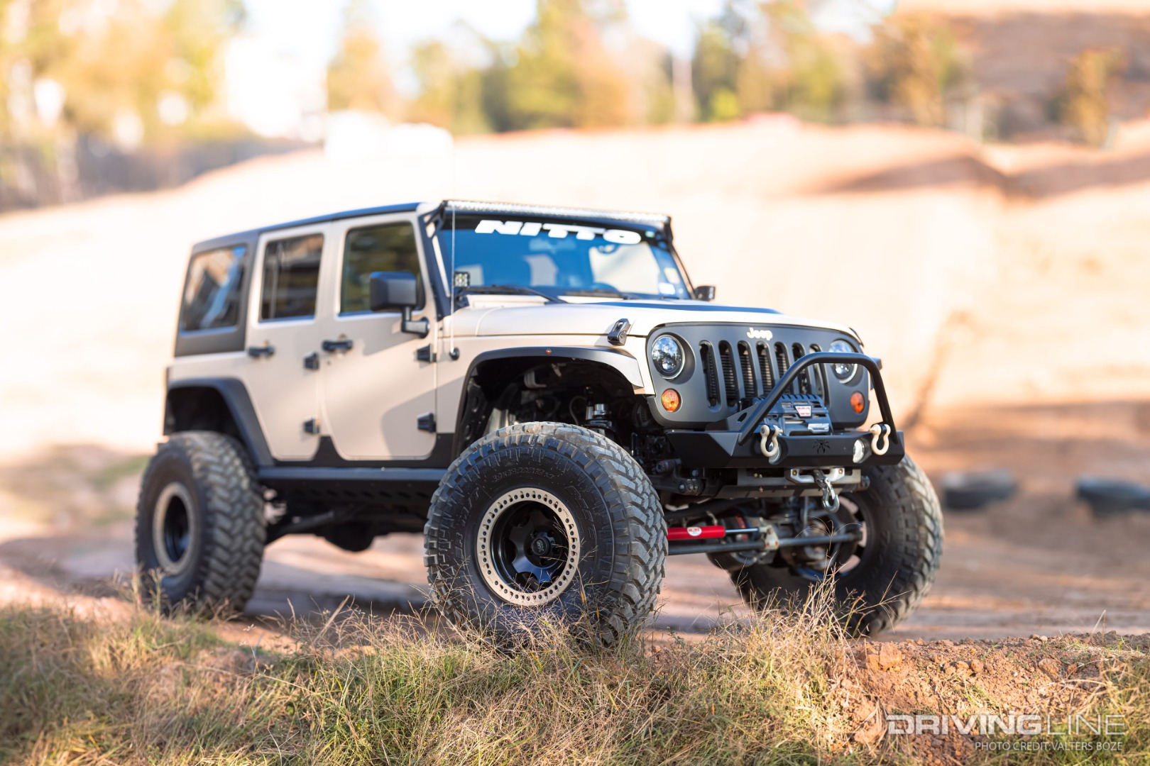 Joe Napoleon's HEMI-powered Jeep Wrangler is wrapped in Desert Tan, and trimmed out in matte black bumpers and fenders