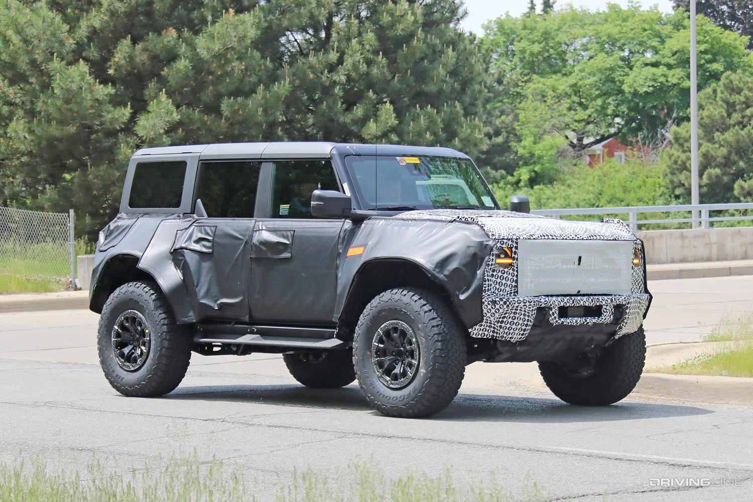 Spy Photos: New Ford Bronco Raptor passenger side heavy camo