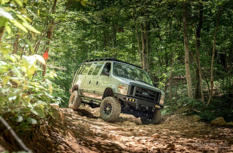 Ford E-350 4x4 Van Conversion Ujoint Offroad in forest