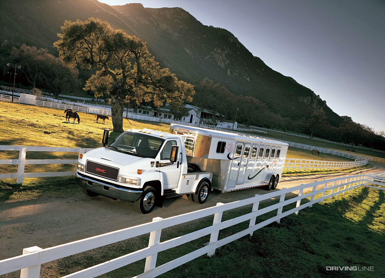 GMC Topkick towing horse trailer