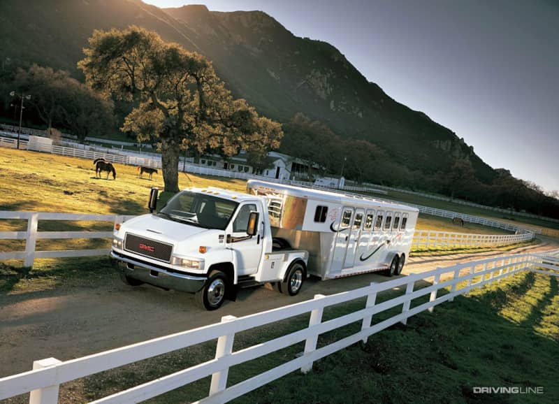 GMC Topkick towing horse trailer