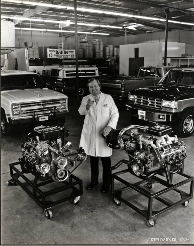 Old photo of Gale Banks with engines and trucks