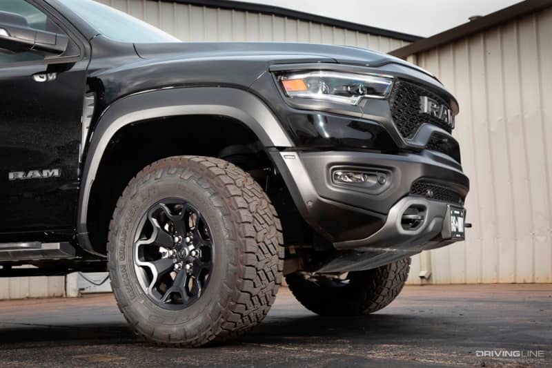 Close up of Nitto Recon Grappler A/T tires on a black RAM TRX 1500 truck