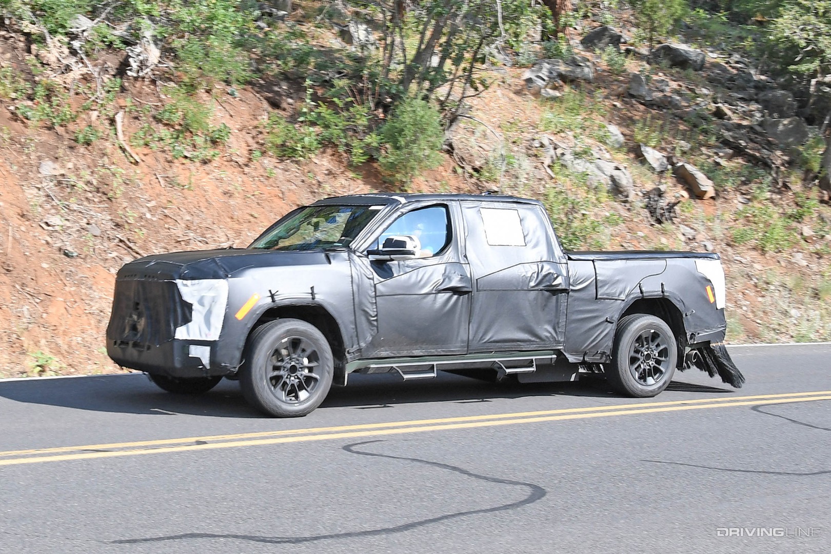 Spy Photos of 2022 Toyota Tundra front driver side in camo