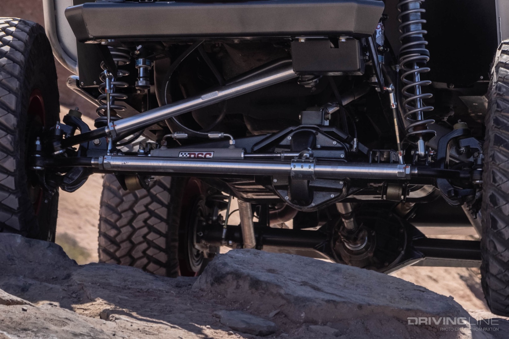 RPM Steering Links with Rare Parts Ends and a Hydraulic Ram Assist Kit from PSC Steering help turn the 37" Trail Grapplers in the rocks.