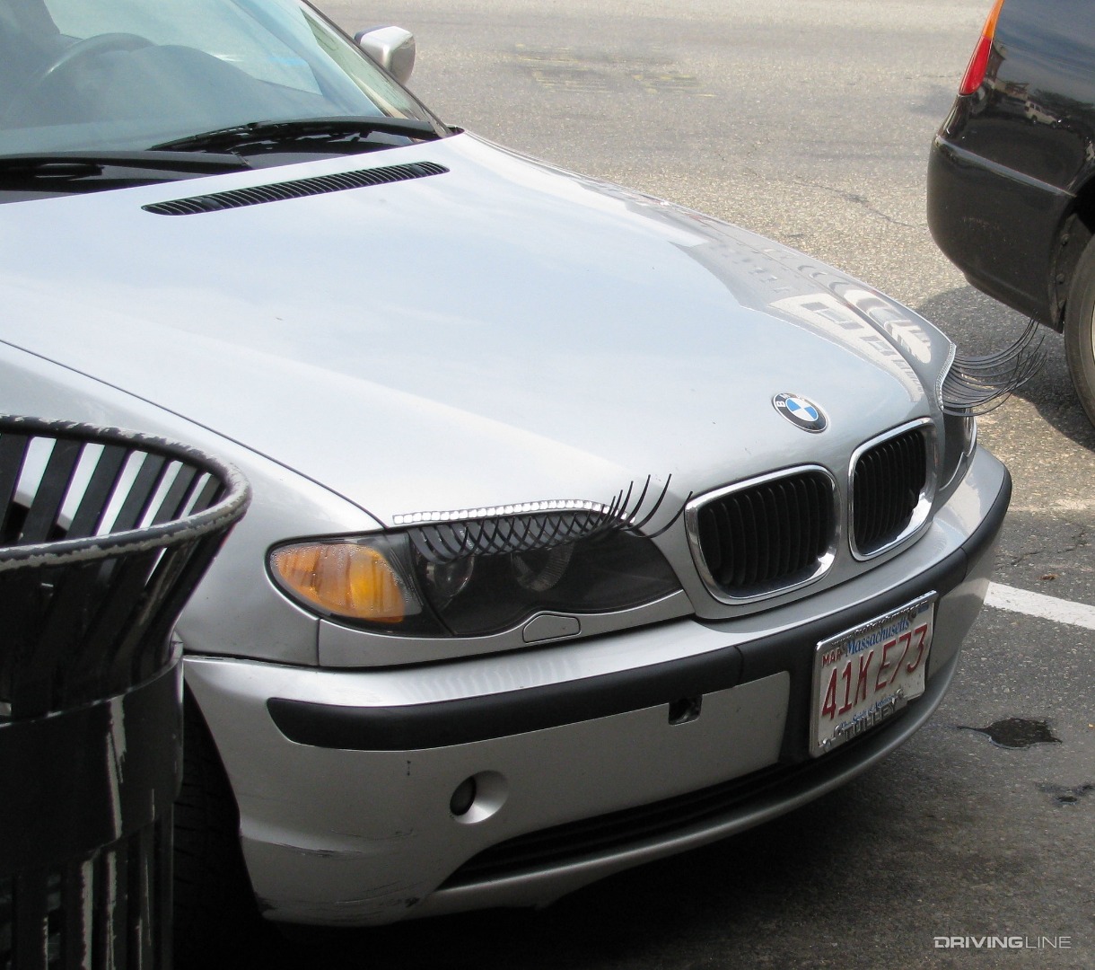 Car lashes on BMW with appropriately-placed garbage can