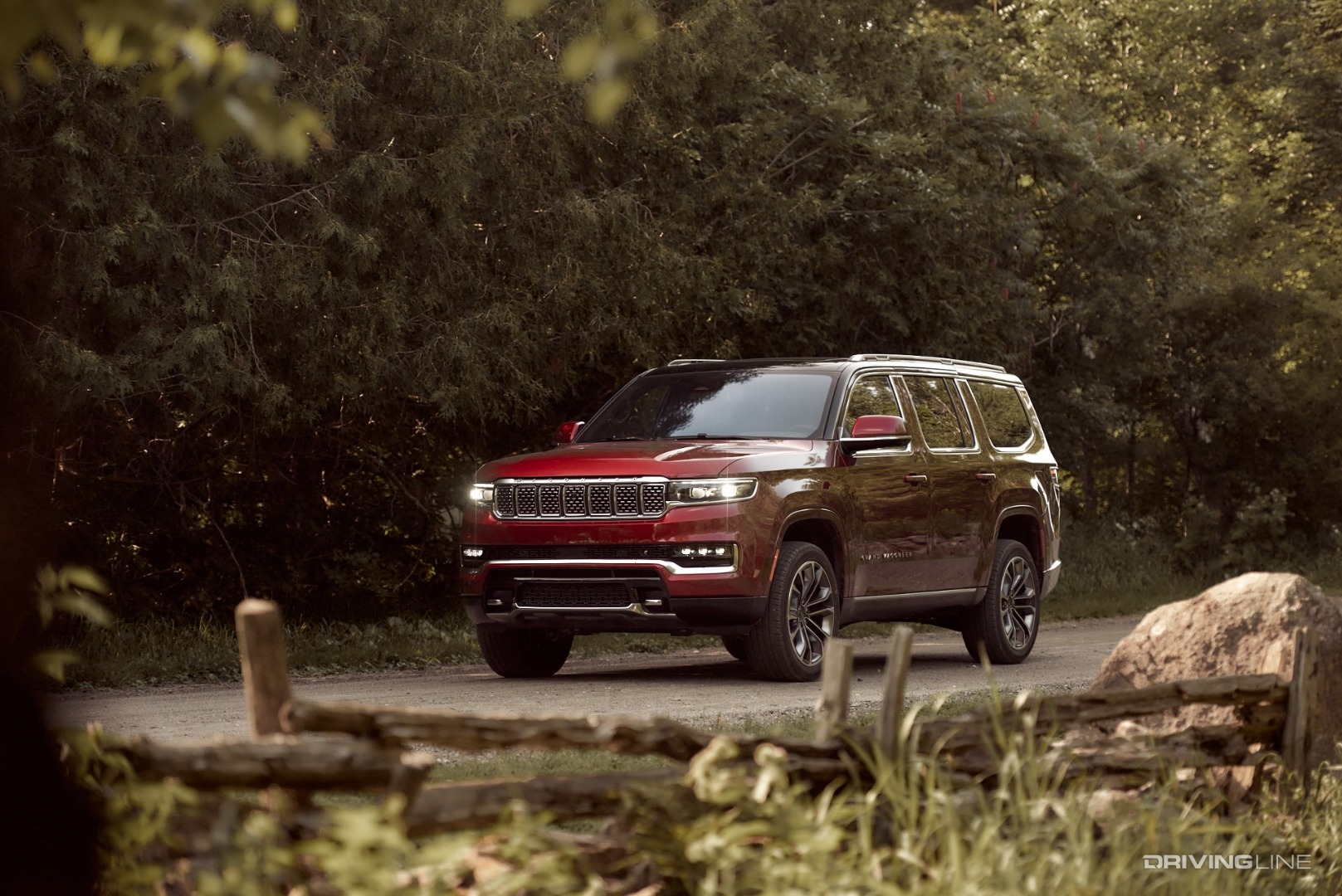 2022 Jeep Grand Wagoneer in motion through fence