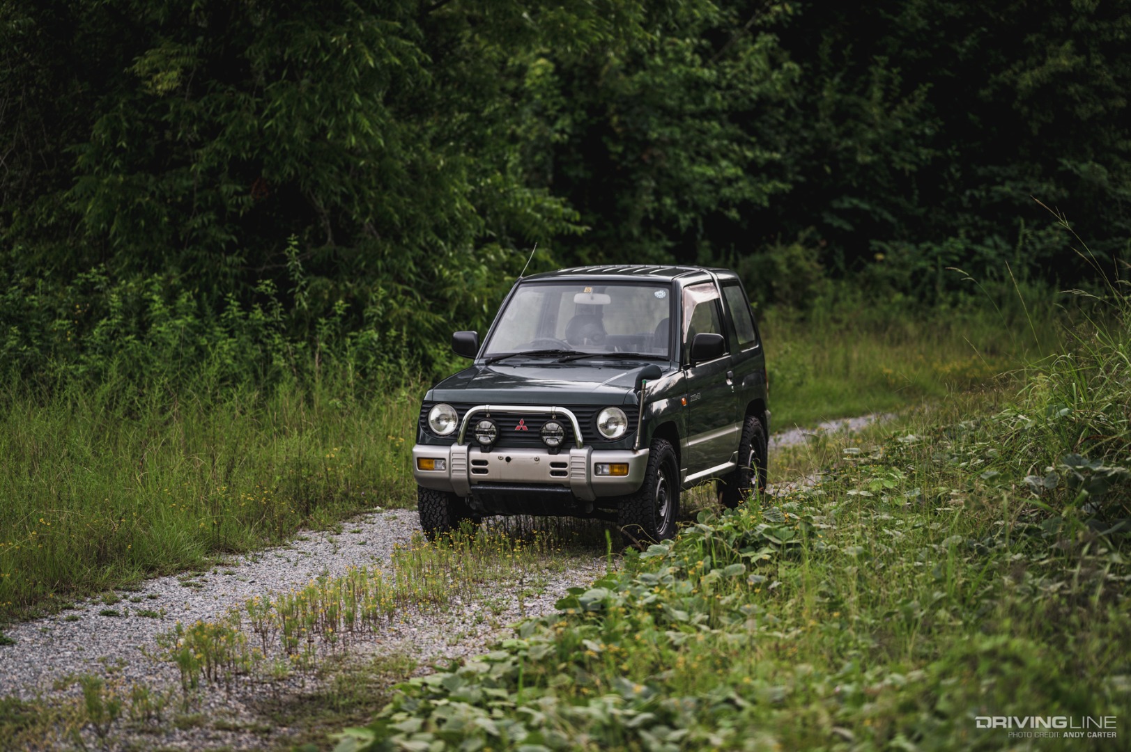Mitsubishi Pajero Mini off-roader on gravel trail