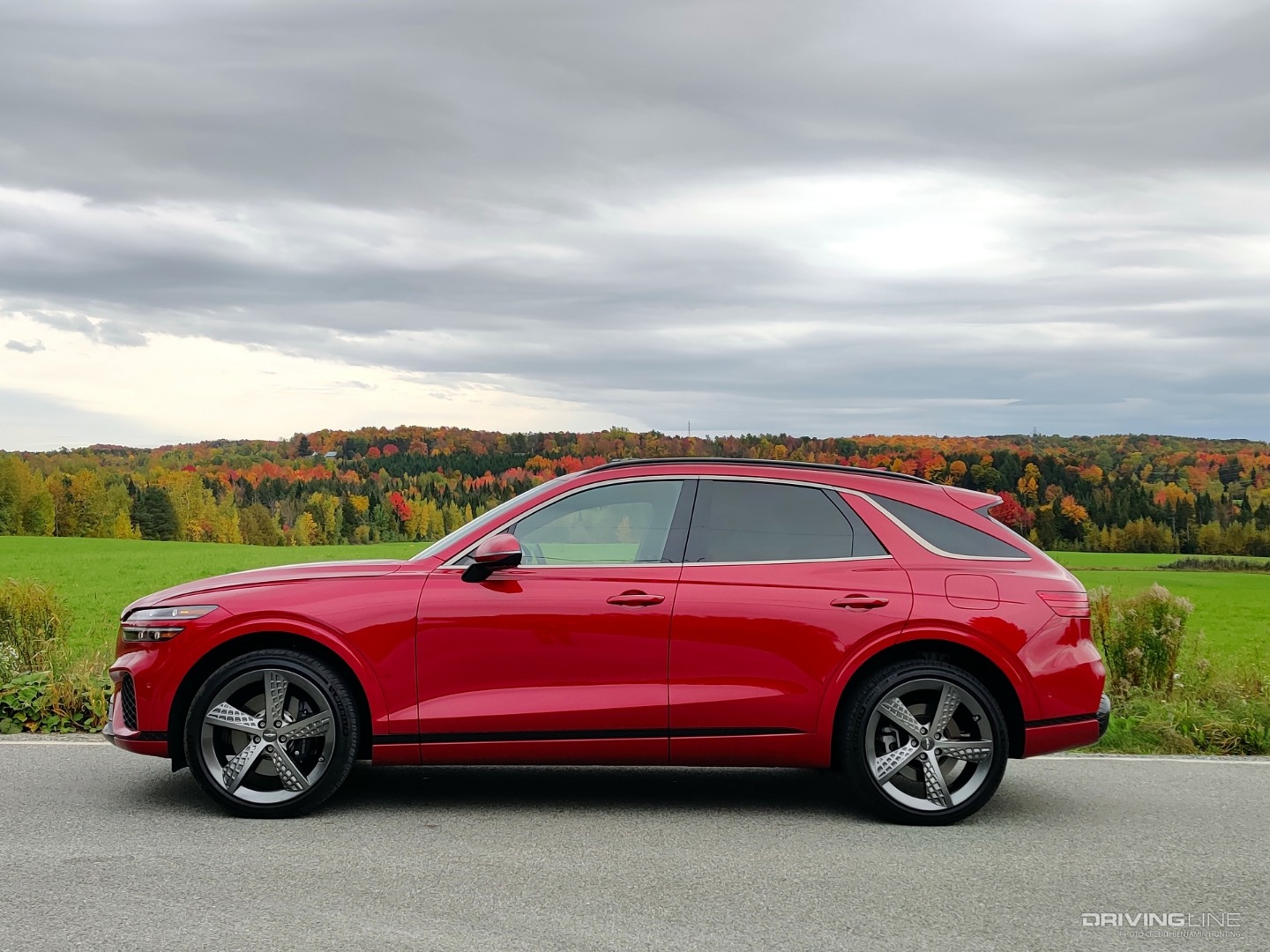 2022 Genesis GV70 side view in front of field