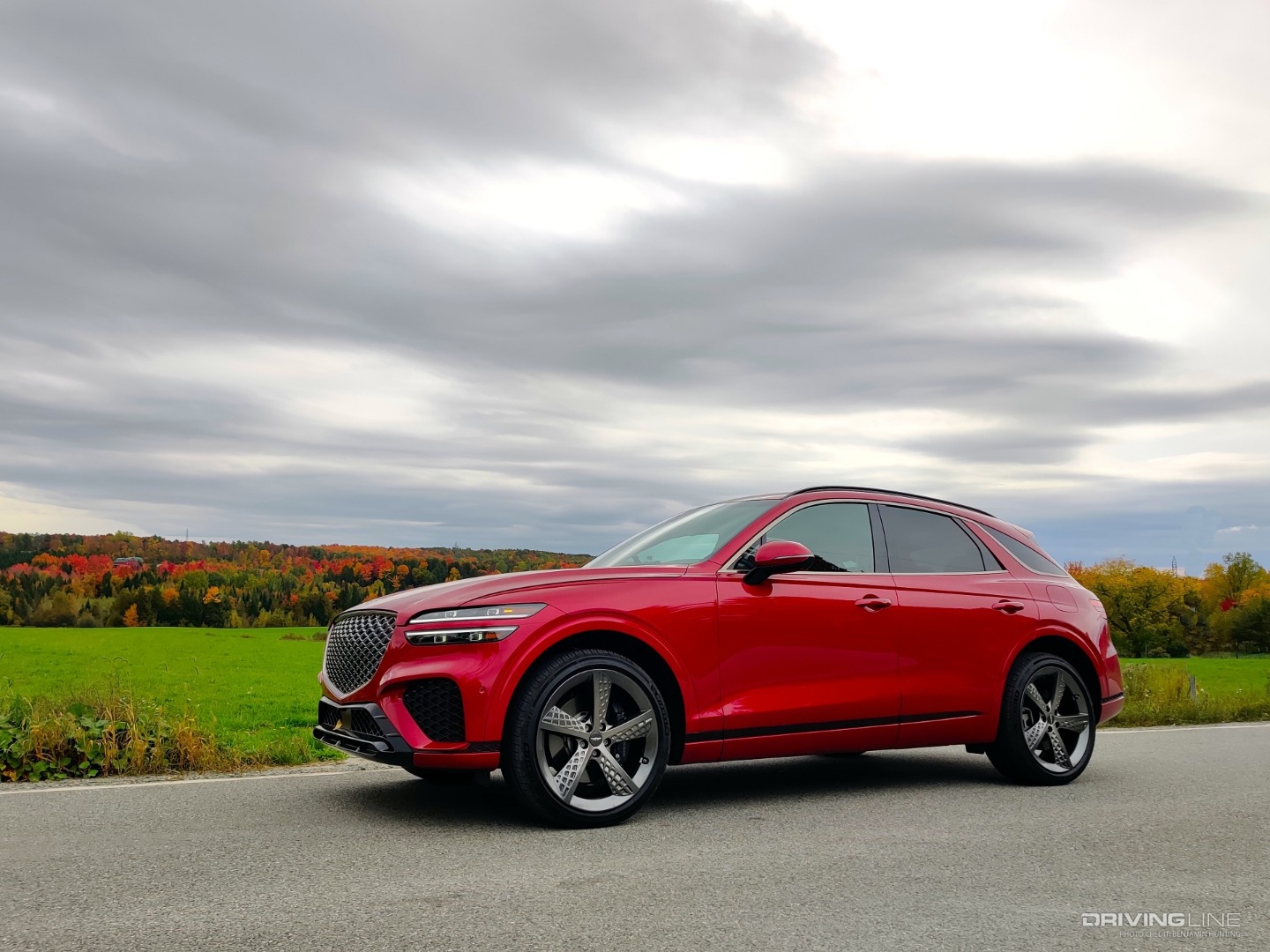 2022 Genesis GV70 red against green field