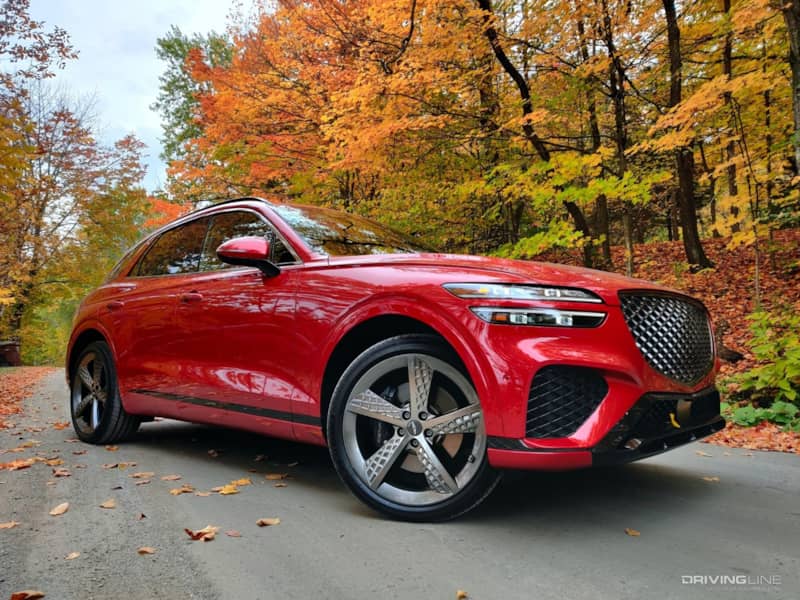 2022 Genesis GV70 low front 3/4 view with leaves