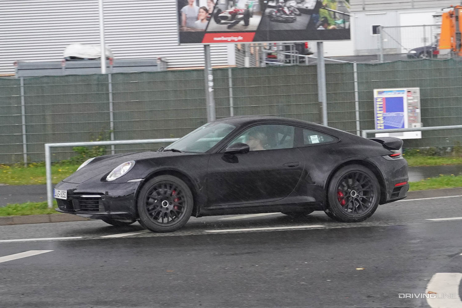 Spy Photos: Upcoming Rally-Inspired, Lifted Porsche 911 Safari turning in rain