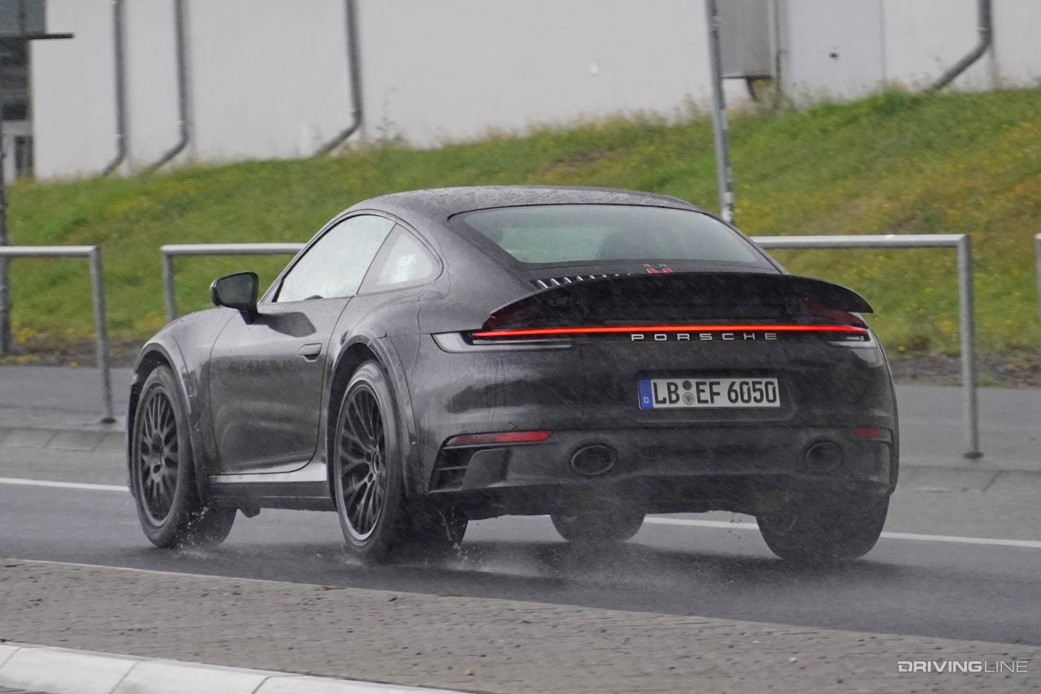 Spy Photos: Upcoming Rally-Inspired, Lifted Porsche 911 Safari rear driver side in rain