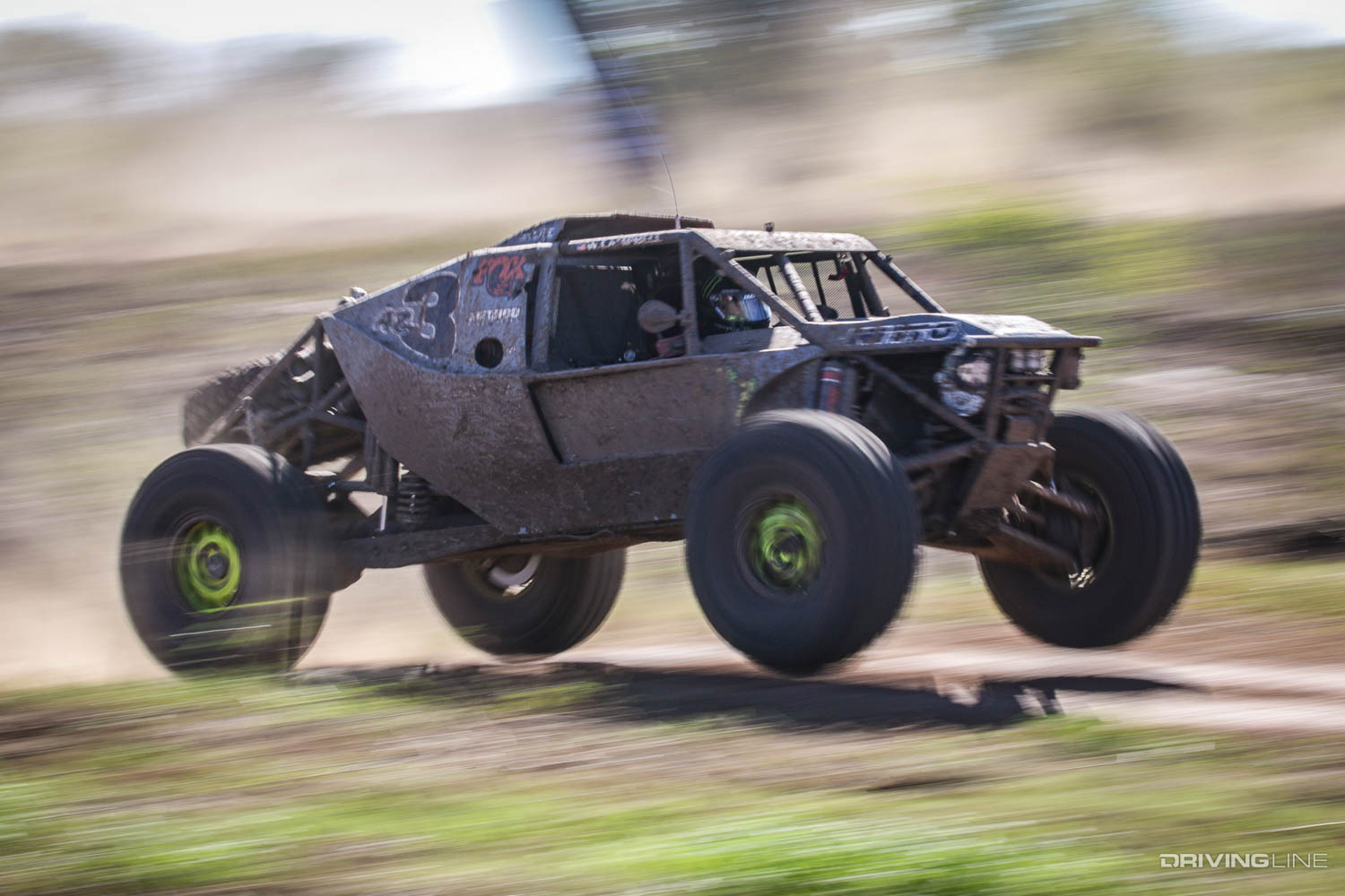 Wayland Campbell driving over a small hill