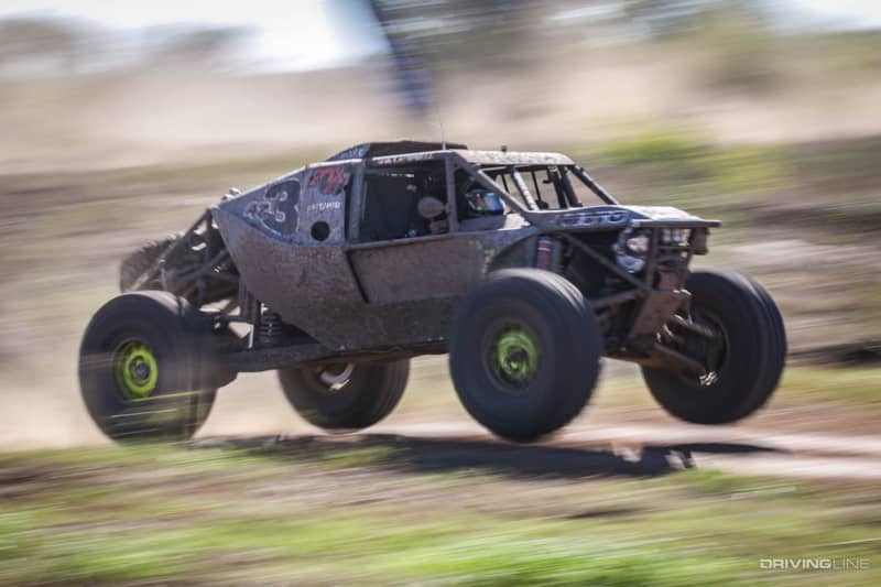 Wayland Campbell driving over a small hill