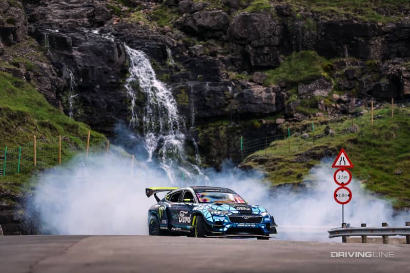 Ford Mustang Mach-E 1400 RTR drifting in front of waterfall