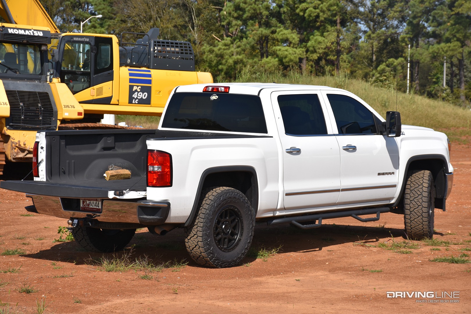 Nitto Recon Grappler tires on a GMC Sierra 1500 on a job site