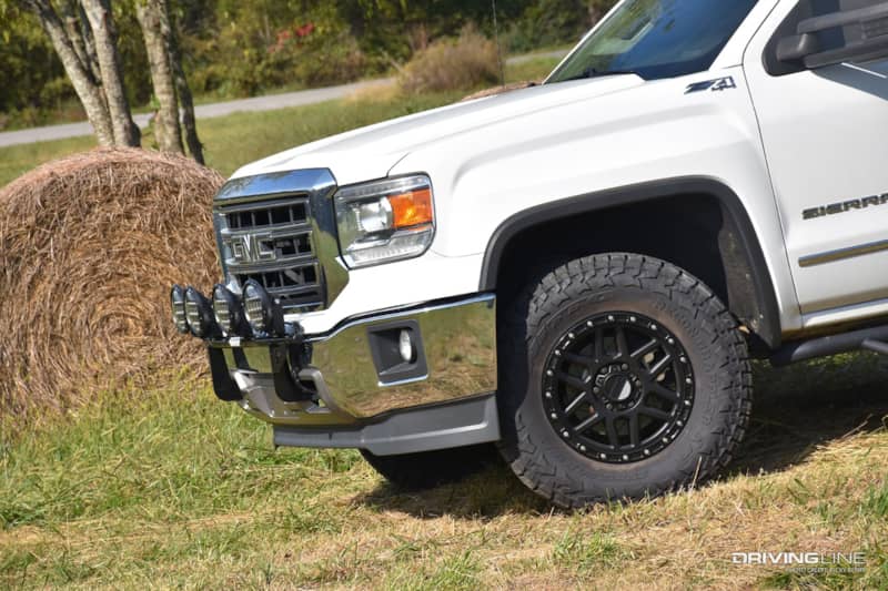 Nitto Recon Grappler all-terrain tire on a white GMC Sierra