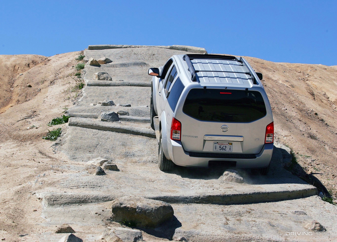 Nissan Pathfinder climbing off-road obstacles