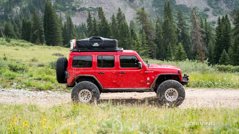 JCR Offroad’s Crusader Rock Sliders protect the rocker panels and allow this JL to pivot or slide off of boulders when encountered.