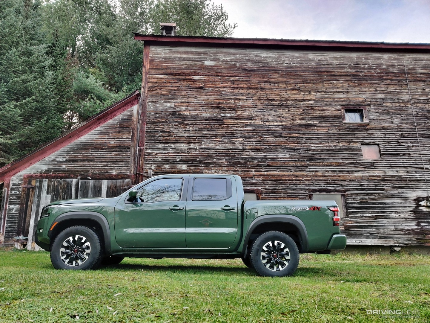 2022 Nissan Frontier side profile in front of barn