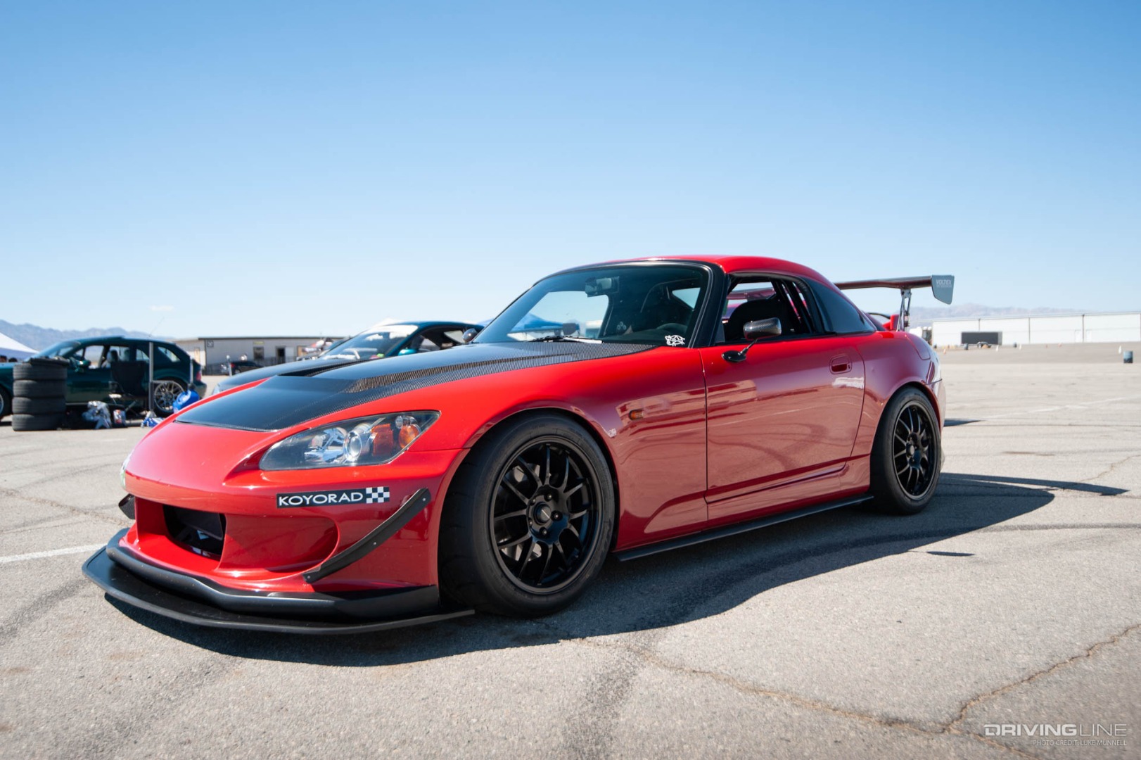 Honda S2000 in red on Nittos at race track