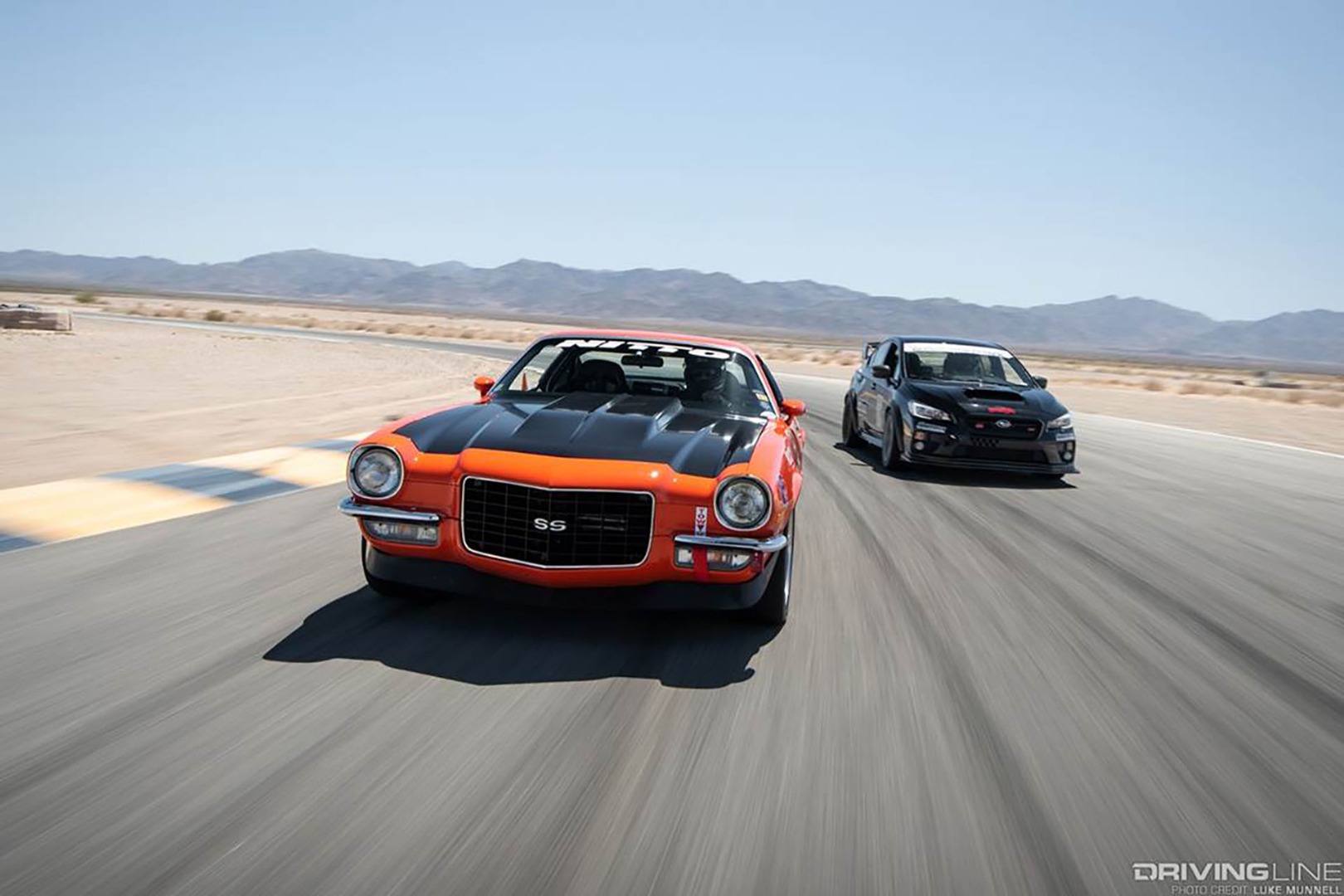 Camaro SS and CIvic Type R with Nitto banners on track