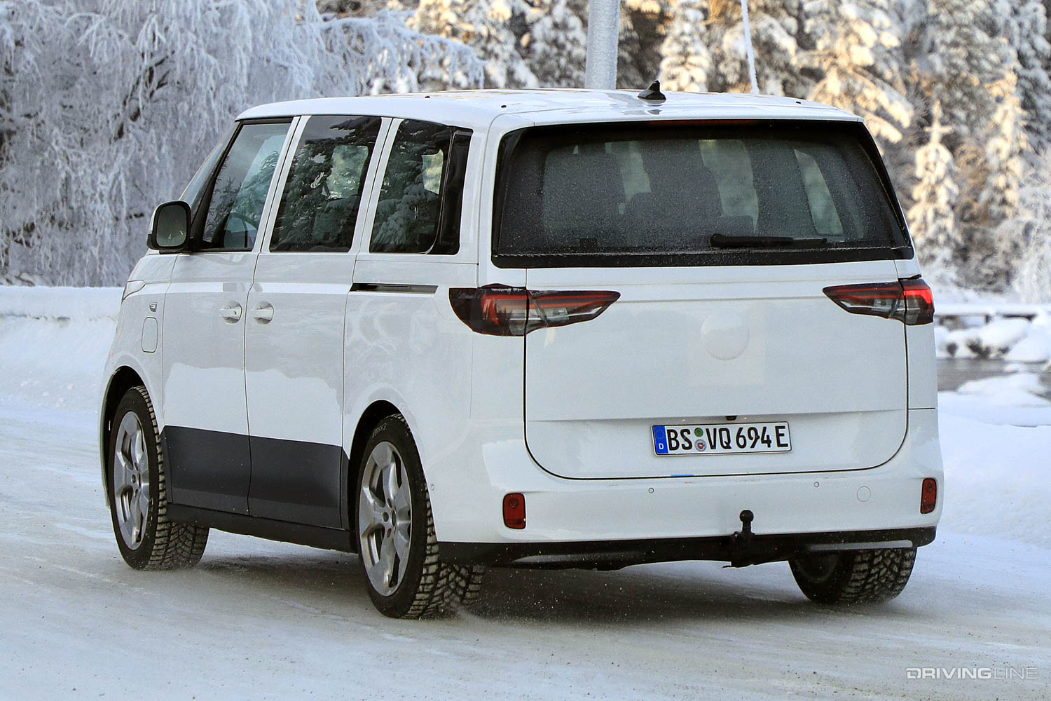 Rear left side of VW's ID.Buzz All-Electric Van on a snowy road